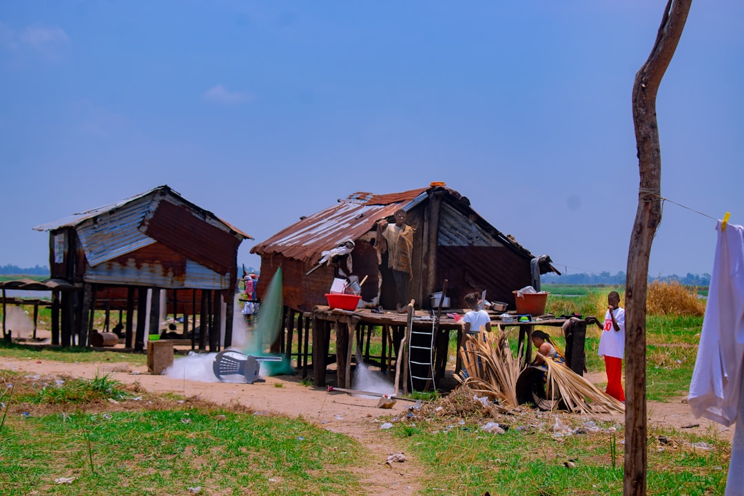 services-01 Stilt Houses With Corrugated Metal Roofs In A Rural Setting Njzd2dnqk04